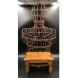 A small carved oak stool 30cms w x 21cms d x 18.5cms h. together with a wicker mannequin torso and