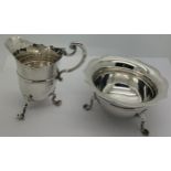 A silver cream jug and sugar bowl, London 1905, makers mark rubbed. Weight 187.6gms.Condition