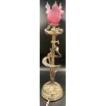 An Art Nouveau style table lamp with lamp with pink glass shade. 66cms h. 46cms excluding shade..