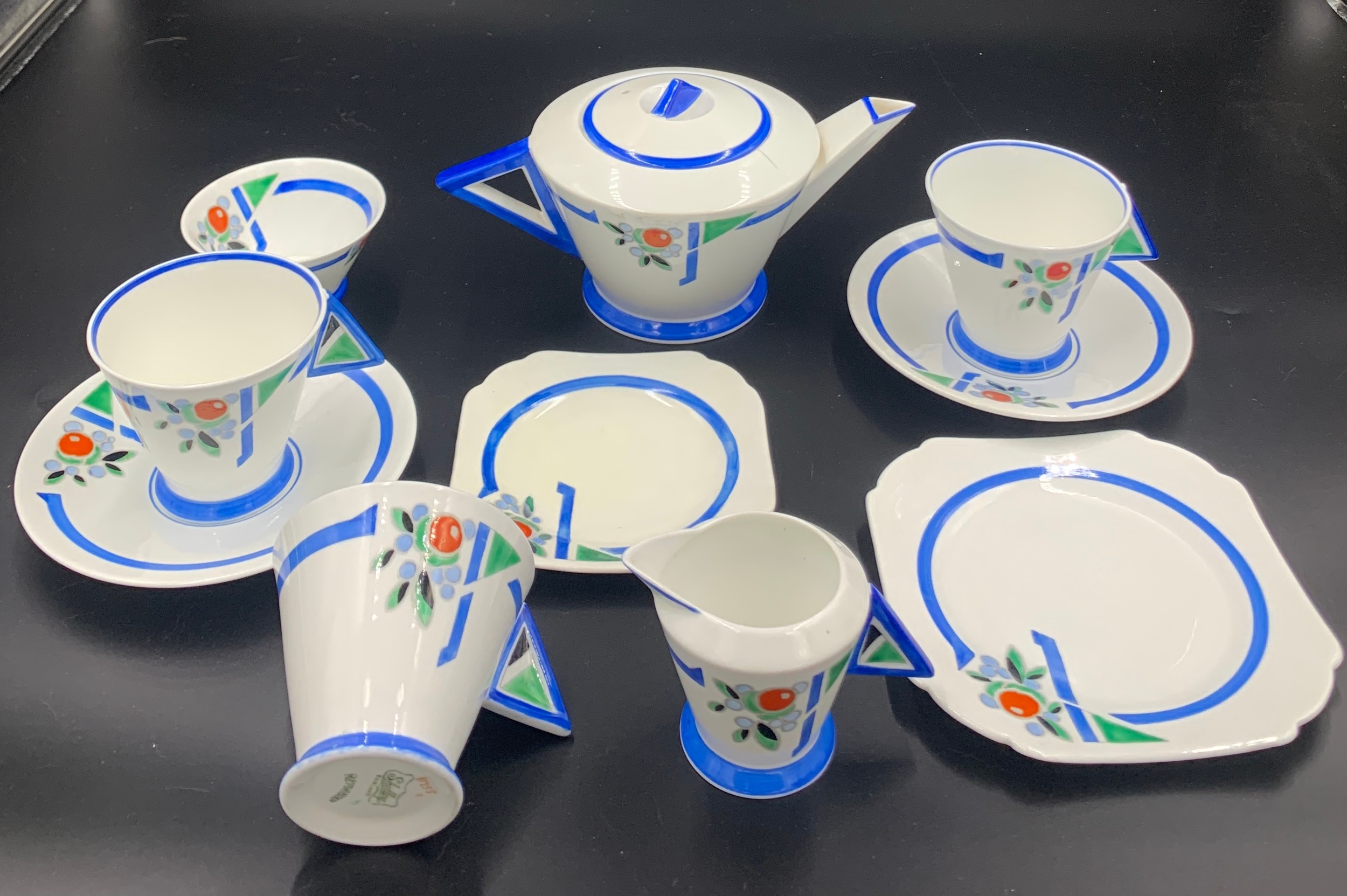 A Shelley part Art Deco period tea service to include a teapot, milk, sugar, 3 cups, 2 saucers, 1