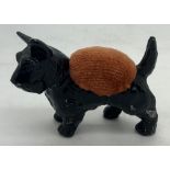 Scottie dog pincushion. 5cms h.Condition ReportSome loss to paint.