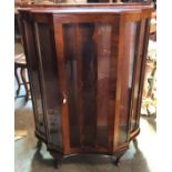 A walnut veneered china cabinet with single doors and cabriole legs. 9cms w x 35cms d x 119cms h.