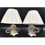 A pair of Schau Bach Kunst, Germany porcelain cherub lamps. 20cms to light fitting, 17cms with