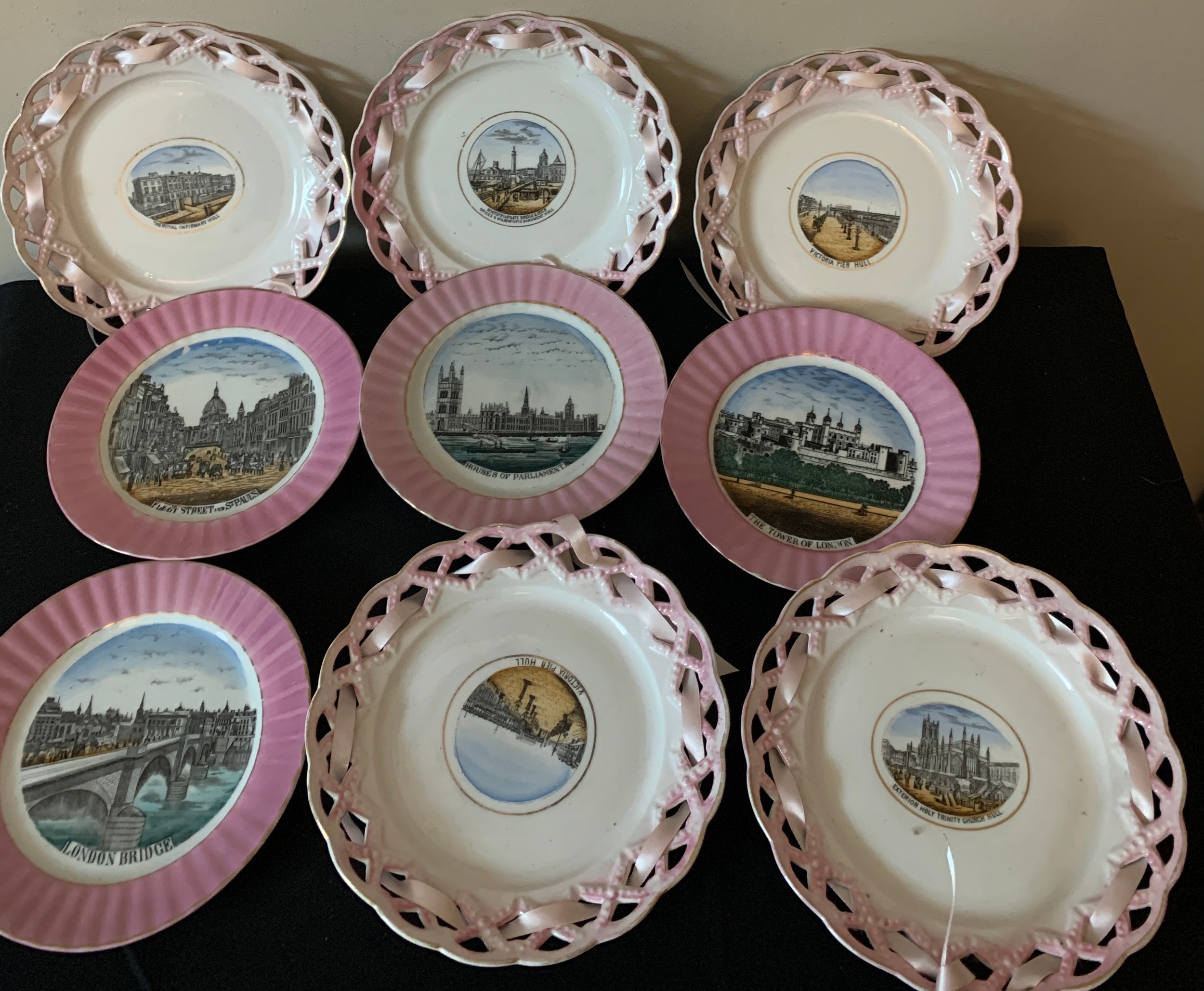 A selection of nine 19thc pink lustre souvenir plates with various scenes of London and Hull to