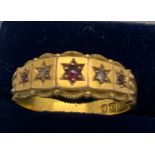 A 15ct gold ring set with diamond and rubies. Size P. 2.8gms.Condition ReportGood condition.