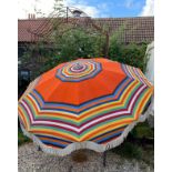 A French Vintage beach parasol marked Veritable O.N.M. Paris. Radius 96cms. Pole 3.1cms approx.