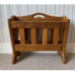 Alan 'Acornman' Grainger of Brandsby, oak magazine rack with slatted tapering sides bearing a