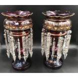 A pair of gilt and floral painted ruby glass lustres with clear glass droplets. 39cms h.Condition