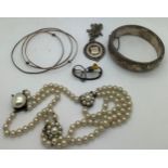 Jewellery to include a hallmarked silver bangle, a hallmarked silver medal on a white metal chain, a