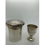 A silver lidded jar London 1917 by Mappin & Webb together with a silver egg cup, London 1896 by