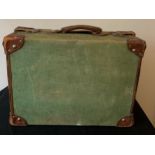 A vintage canvas and leather suitcase. 51 x 37cms.Condition ReportWear to leather.
