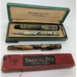 A boxed Platignum de Luxe fountain pen and pencil with a Swan self filling pen.Condition