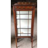 An Edwardian mahogany inlaid display cabinet. Height to back 147cms x 59ms w x 30cms d. With key.