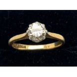 A solitaire diamond ring set in 18ct yellow gold and platinum. Size O. Approximate diamond 0.5ct.