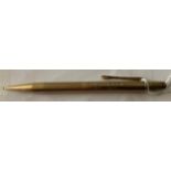 A 9ct gold propelling pencil. 19.9gms.Condition ReportReplacement top, slight dents.