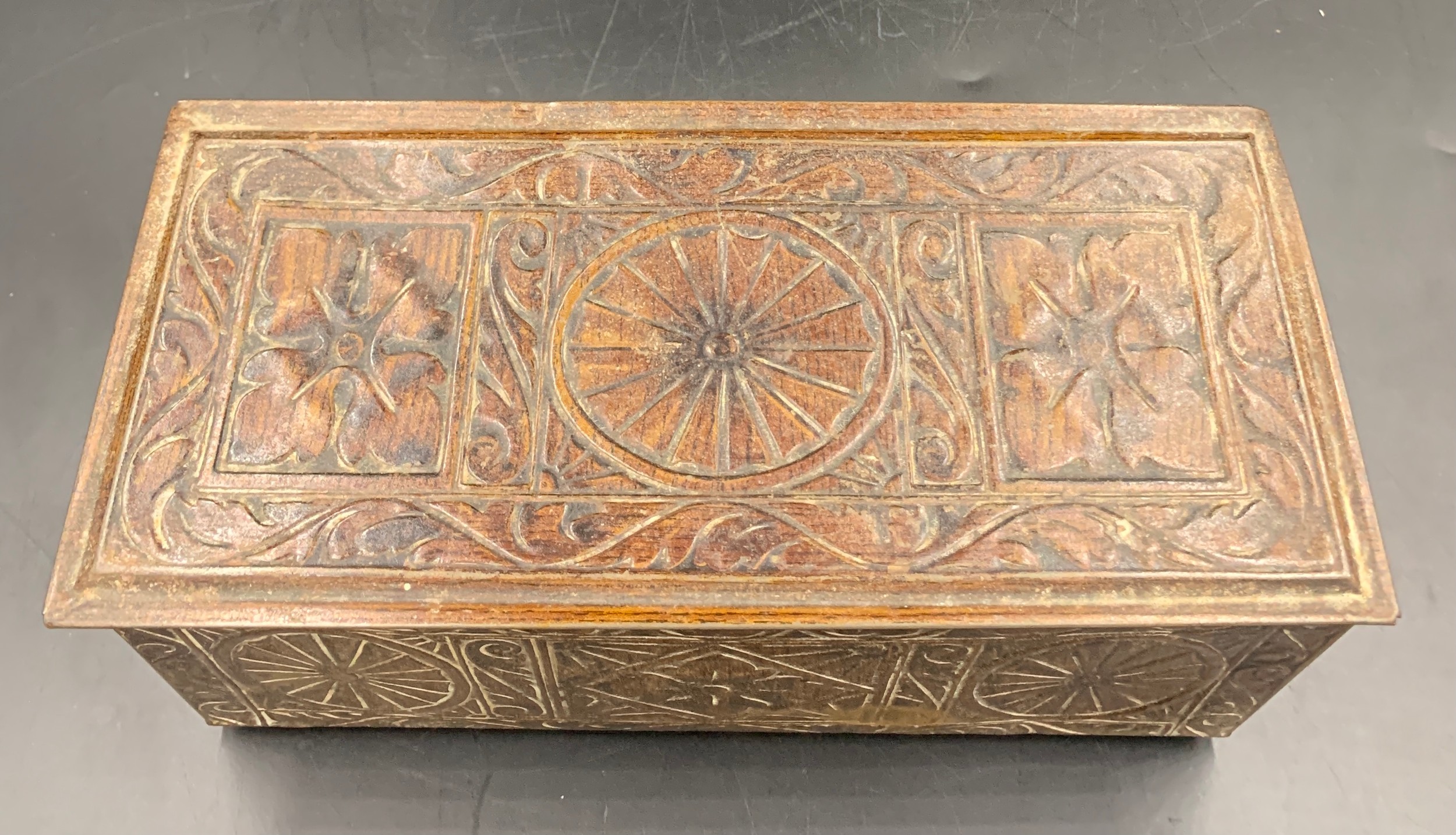 A vintage biscuit tin in the form of a carved oak coffer. 27 x 12 x 12cms h.Condition ReportGood - Image 2 of 6