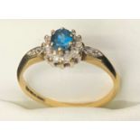 A 9ct gold blue stone and diamond cluster ring. Size P. 2.1gms.Condition ReportGood condition.