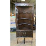 A corner cabinet with lower door. 192 h x 83 w x 62cms d.