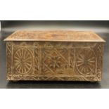 A vintage biscuit tin in the form of a carved oak coffer. 27 x 12 x 12cms h.Condition ReportGood