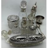 A quantity of silver topped glass jars, scent bottles, hair tidy, mustard spoon and egg cup with