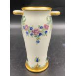 A William Moorcroft for Macintyre Burslem vase with floral garlands and rosettes. 19cms.Condition
