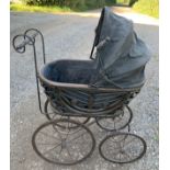 A cane and metal dolls pram. 54 l x 35 w x 87cms l.Condition ReportGood condition.