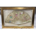 A deep cased gilt framed Victorian silk and bone fan. Hand painted with fairies and pink flowers.