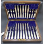 A cased set of twelve Silver and mother of pearl dessert knives and forks Sheffield 1923.Condition