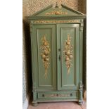A Mark Rowan hand painted pine armoire. Shelves to interior and drawers to base, depicting panels of