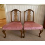 A pair of 1930's walnut upholstered bedroom chairs 75cms h x 46cms w to front of seat 31cms.
