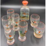 A 1930's enamelled glass decanter and 7 glasses with hunting scenes.Condition ReportGood condition.