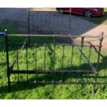 A 19thC brass and iron double bedstead. 4'6'' wide with iron and wooden slats.