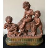 A plaster group of cherubs and a goat, signed Cipriani?Condition ReportChips to plaster in places.
