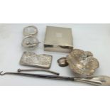 Silver to include card holder, bonbon dish, glass & silver salts, cigarette box, button hook etc.