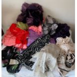 A large quantity of fabric and scarves, shawls etc to include a C19th black silk apron, a 1960's