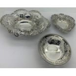 Three hallmarked silver dishes, all with pierced decoration and various dates and makers. Total