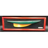 A framed half model boat "Shamrock 1930". Model 48cms. Frame size 60cms w x 18.5cms h.Condition