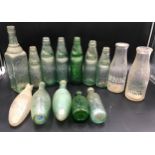 A collection of green glass mineral water and cod bottles and 2 milk bottles, various makers and