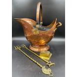 A copper coal helmet 39cms w, two brass toasting forks with squirrel and dog handles and a brass