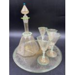 A Murano glass decanter set. Decanter 22cms h 4 glasses 10cms h and glass tray.