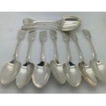 Nine silver dessert spoons. Seven London 1871 maker Henry Holland and two London 1805 maker