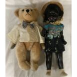 A 52cm tall doll with straw hat, dress, sock and shoes together with a cream bear with leather