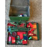 A tin box containing a selection of Meccano.