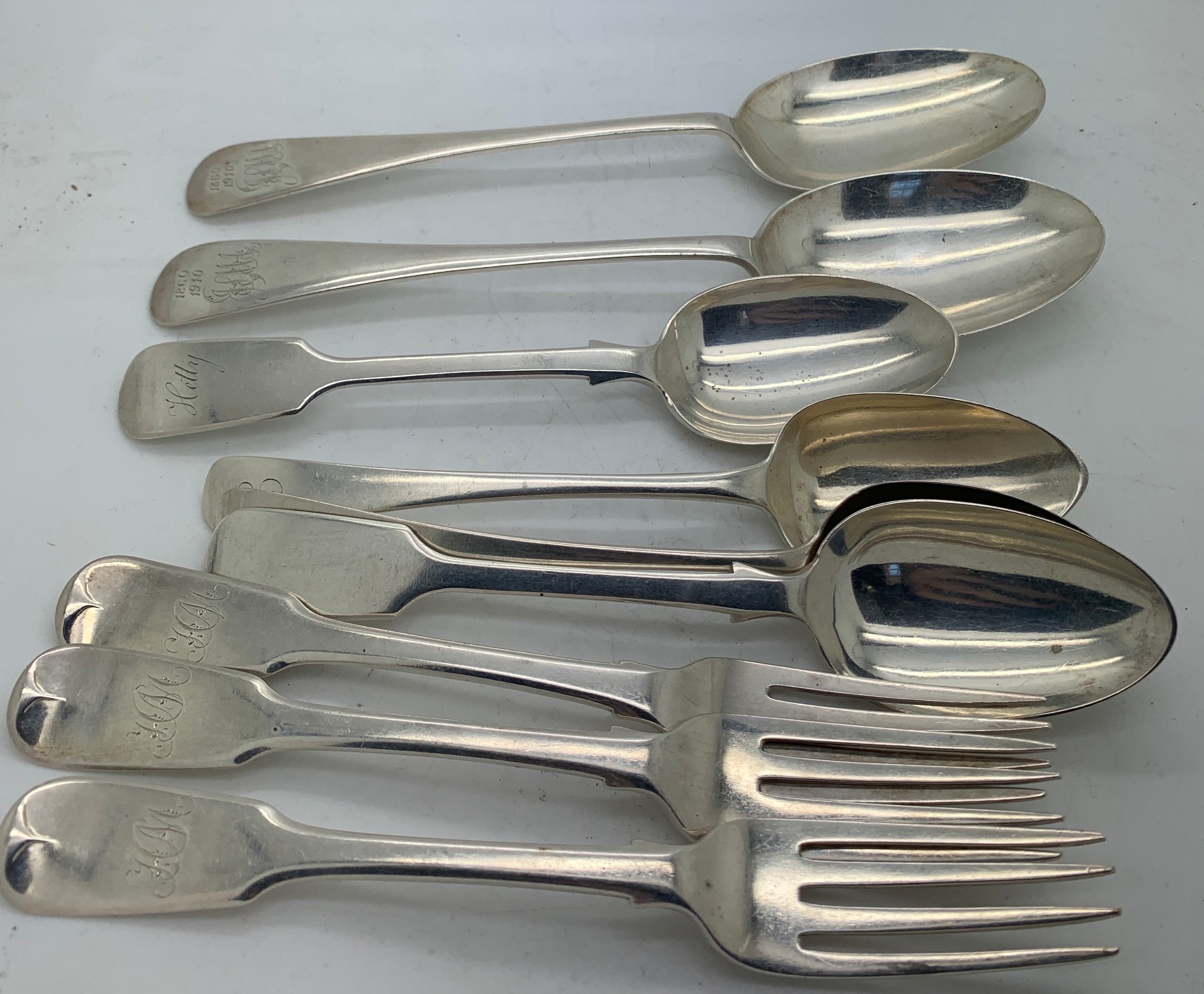 Silver cutlery to include 2 tablespoons, 4 dessert spoons and 3 forks. Various dates and makers .