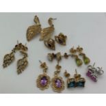 Eight pairs of gem set earrings set in 9ct yellow gold. Total weight 14gms.Condition ReportGood