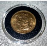 George V 1927 full Gold Sovereign in capsule.Condition ReportVF.