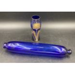 A 19thC Bristol blue glass rolling pin 37cms l together with a blue and gilt vase 16cms h.