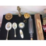 Miscellany to include brass pull door bell, dressing table set, glass rolling pin, kettle stand