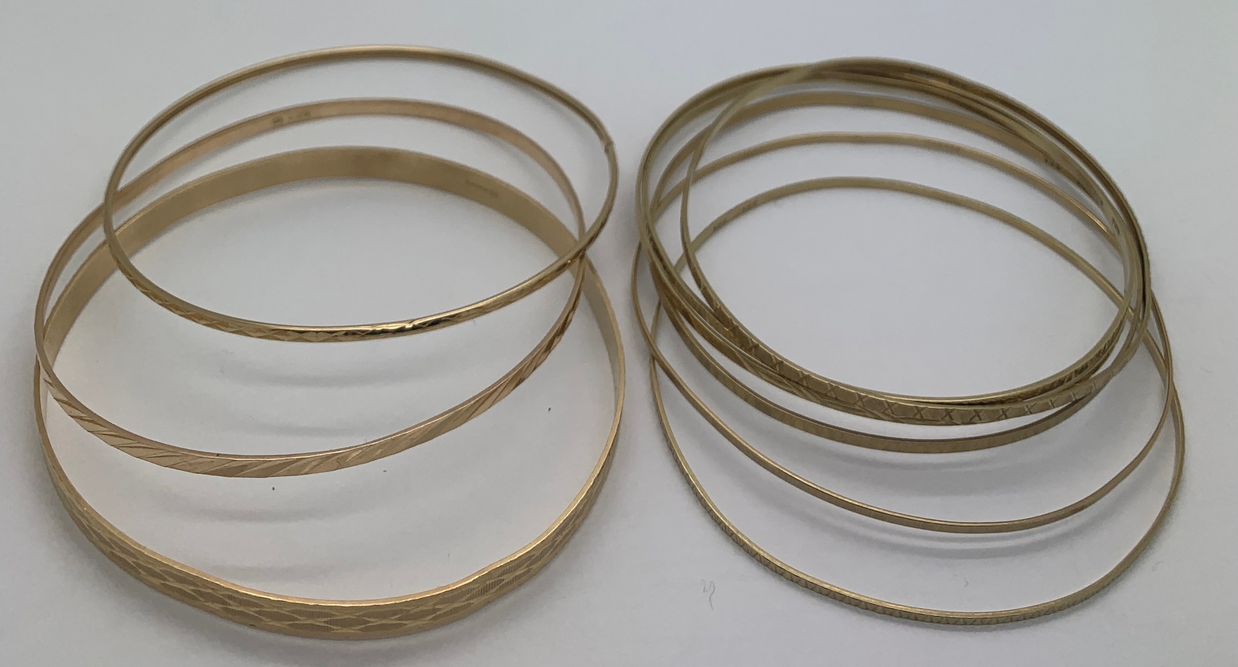 Nine various gold bangles, 6 marked 8ct (16gms) and 3 marked 9ct gold (14.3gms). Total weight 30.