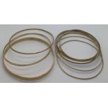 Nine various gold bangles, 6 marked 8ct (16gms) and 3 marked 9ct gold (14.3gms). Total weight 30.